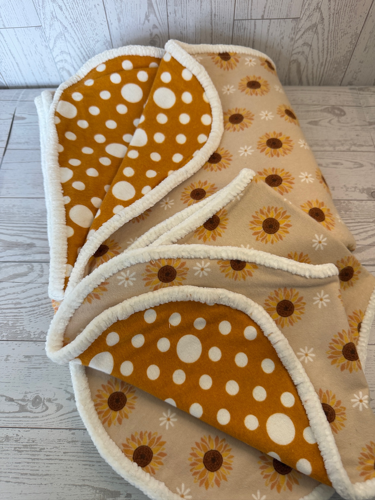 Handmade sunflower flannel baby receiving blanket with gold polka dot reverse and plush trim